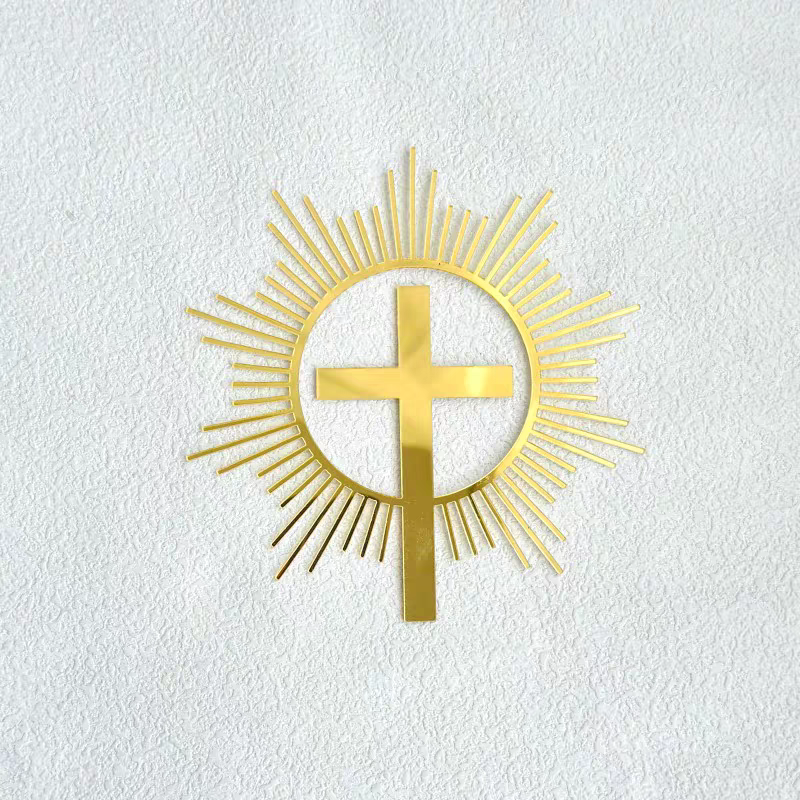 A gold cross Christian Cake Topper with sun-like rise around